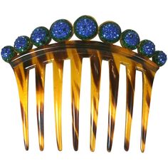 Art Deco Pave Ball Comb form the 1920's. Graduated half spheres are pave set with emerald and sapphire paste stones on top of a faux tortoiseshell comb. 1920's USA. 5" x 4" high. Excellent condition. Sapphire Hair, Tortoise Shell Jewelry, Art Nouveau Hair, Antique Hair Combs, Victorian Hair, Gold Fox, Art Deco Hair, Victorian Hairstyles, Vintage Hair Combs