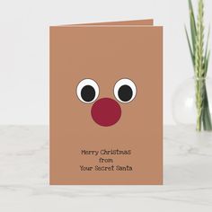 a christmas card with a reindeer's nose and the words merry christmas from your secret santa