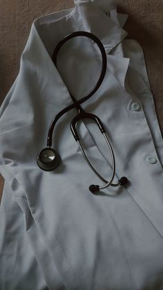 a white shirt with a stethoscope laying on it