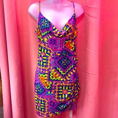 Be The Life Of The Party In The Neon Abstract Dreams Dress. Made With 85% Polyester And 15% Spandex, This Dress Features Eye-Catching Abstract Neon Designs That Will Turn Heads. Embrace Your Vibrant Side And Make A Bold Fashion Statement With This Unique And Stylish Piece. Pink Printed Mini Dress For Party, Patterned V-neck Party Dress, Multicolor Print V-neck Party Dress, Flirty Printed Mini Dress For Party, V-neck Dress With Colorful Pattern For Party, Fitted Printed Dresses For Summer Parties, Fitted Multicolor Mini Dress For Summer Parties, Multicolor Geometric Sleeveless Dress, Spring Party Mini Dress In Patterned Color