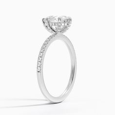 a diamond engagement ring on a white background