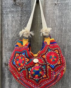 "Upcycled vintage Guatemalan \"Huipil\" textile ,with leather & antler trim & authentic Oaxacan tassel, makes for a colourful summer accessory, Full red satin lining with leather pocket." Traditional Summer Bags With Leather Handles, Artisan Festival Bag With Leather Handles, Red Woven Shoulder Bag For Travel, Artisan Shoulder Bag With Leather Handles For Festivals, Handwoven Red Shoulder Bag For Travel, Red Handwoven Shoulder Bag For Travel, Summer Festival Shoulder Bag With Tassels, Red Tote Hobo Bag For The Beach, Festival Multicolor Woven Hobo Bag