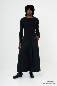 Each leg is made from the same side-seam-free tube as our Trash Tee. Fit is drapey and voluminous, with an ultra wide leg, elastic waistband, extra long drawcord, and side pockets. Details - 100% North American Reclaimed Waste Cotton- 6.5 oz jersey- Midweight cotton- Unisex- One size fits many- Biodegradable, except for the elastic- Preshrunk and ready to wear- Knit, sewn and finished in Los Angeles, California with a fair-wage workforce Size Chart Measurements are approximate and may deviate 1' Wide Leg Parachute Pants For Fall Loungewear, Boxy Fit Wide Leg Bottoms With Elastic Waistband, Oversized Wide Leg Bottoms With Elastic Waistband, Loose Fit Wide-leg Pants With Elastic Waistband, Oversized Wide-leg Pants With Elastic Waistband, Versatile Wide Leg Parachute Pants, Oversized Wide Leg Pants With Elastic Waistband, Versatile Wide Leg Parachute Pants With Elastic Waistband, Stretch Wide Leg Parachute Pants For Fall