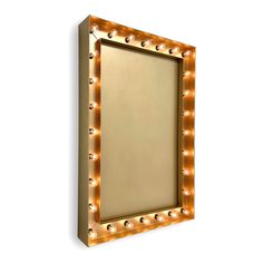 a mirror with lights around it on a white wall and the reflection is in the frame