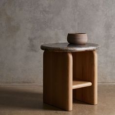 a small table with a bowl on it