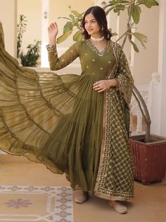 Introducing our stunning "adorable olive green embroidered georgette mehendi wear gown", a classy and elegant choice for your next special event. This beautifully crafted gown comes in a rich olive green color with intricate embroidered and sequin work, making it a perfect outfit for festivals, events, or any function.
This gown include a fully stitched design in sizes ranging from XS to XXL, a generous 15-meter flair for a glamorous look, and a gown length of 56 inches. The accompanying georget Green Floor-length Kurta For Reception, Green Georgette Kurta For Reception, Green Maxi Length Salwar Kameez For Reception, Green Dress With Chikankari Embroidery In Traditional Drape, Green Dress With Chikankari Embroidery, Traditional Drape, Green Maxi Length Designer Traditional Wear, Green Anarkali Dress With Chikankari Embroidery, Elegant Pista Green Georgette Gown, Green Anarkali Set With Resham Embroidery In Maxi Length