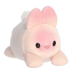 a pink stuffed animal with black eyes and ears