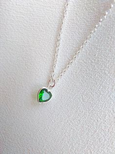 "Sterling Silver necklace with emerald. Size shown is 16\". Please choose your favorite necklace length at checkout. All lengths have a one inch extender, that way you'll have some wiggle room to play with the length. For example, if you choose a 14 inches necklace length, you'll have options to close the necklace at any length between 14 inches and 15 inches. Some of this charms are sold by themselves (no chain). If that option is available for this, you will have the option to buy \"CHARM ONLY Heart-shaped Emerald Jewelry For Valentine's Day, Valentine's Day Heart Shaped Emerald Jewelry, Green Heart Charm Jewelry For Anniversary, Emerald Jewelry With Heart Charm As Gift, Heart Cut Emerald Necklace For Gift, Heart-shaped Emerald Jewelry For May Birthstone, Green Heart Pendant Jewelry For Anniversary, Green Heart Pendant Necklace For Mother's Day, Emerald Jewelry For Valentine's Day Gift