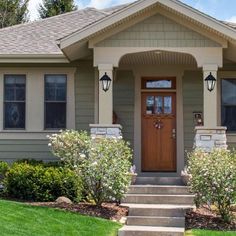 a house with a front door and steps leading up to it