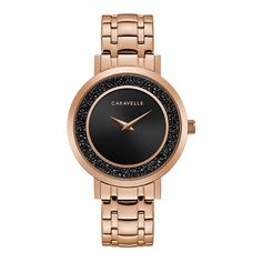 This Caravelle by Bulova women's watch features jet black rock crystals surrounding a minimalist black sunray inner dial. Rose gold-tone accents on dial and crown complement the rose gold-tone stainless steel case and five-link bracelet. This Caravelle by Bulova women's watch features jet black rock crystals surrounding a minimalist black sunray inner dial. Rose gold-tone accents on dial and crown complement the rose gold-tone stainless steel case and five-link bracelet. Click on this JEWELRY & Crystal Watches, Black Rock, Watch Model, Women's Watch, Rock Crystal, Stainless Steel Watch, Minerals Crystals, Black Crystals, The Rose