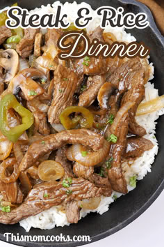 steak and rice dinner in a skillet on top of white rice with green peppers