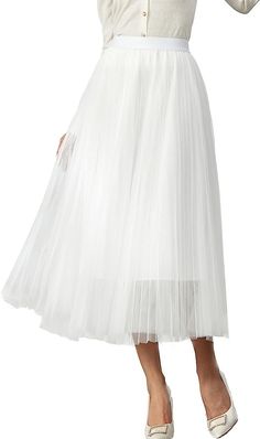 Look your best in the Prestigious Tulle Pleated Flowy Maxi Skirt. This lightweight and comfortable skirt is crafted from soft tulle that is pleated for maximum comfort. Its flowy skirt design adds a touch of class and elegance to your wardrobe. Perfect for formal occasions or everyday wear. 100% Polyester Imported Elegant pleated design: This pleated skirt features a beautiful pleated design that creates a flowing, elegant silhouette. The pleats are evenly spaced and give the skirt a luxurious t Flowy Maxi Skirt, Comfortable Skirts, Flowy Maxi Skirts, Winter Knit Hats, Soft Tulle, Black Sparkle, Boot Accessories, Flowy Skirt, Look Your Best