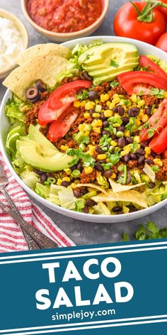 taco salad with tomatoes, lettuce, black beans and avocado