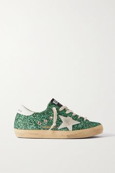 EXCLUSIVE AT NET-A-PORTER. Decorated with a dusting of emerald glitter, Golden Goose's low-top 'Superstar' sneakers will bring a touch of sparkle to your wardrobe. They're made from supple leather and have deliberately distressed suede stars and rubber soles. Slip them on with trusty jeans or a floaty midi dress. Golden Goose Glitter Sneakers, Green Golden Goose, Golden Goose Superstar, Glitter Sneakers, Green Sneakers, Cute Sneakers, Golden Goose Sneakers, Golden Goose Shoes, Golden Goose Deluxe Brand