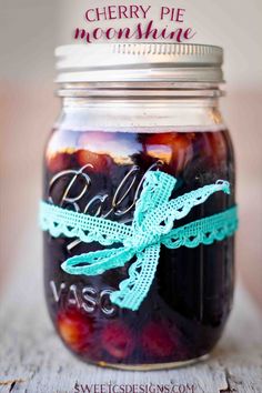 cherries in a mason jar with the words cherry pie moon shine