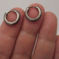 Custom gauged earpost hoop earrings for men. 12G, 14G, 16G, 18G, or 20G hoop earrings. These gauged hoop earrings are 9mm in diameter and are sized M. Sold as a pair or single earring. SPECIFICATION Base metal: Recyclable fine 925 Sterling Silver Outer layer : Black plating, matte finish Outer Diameter: 13mm Inner Diameter: 9mm, size M Width: 2.5mm Ear Post Gauge: 12G, 14G, 16G, 18G, 20G Measurements are an approximation. Available in polished white https://www.etsy.com/listing/250896161 Thank y Small Hoop Metal Cartilage Earring, Single Round Metal Cartilage Earring, Metal Small Hoop Cartilage Earrings, Hypoallergenic Metal Huggie Cartilage Earrings, Metal Huggie Single Earring Piercing, Internally Threaded Hoop Plug Earrings As Gift, Metal Huggie Cartilage Earrings, Minimalist Internally Threaded Metal Cartilage Earrings, Hoop Earrings For Men