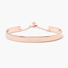 Simple yet sophisticated, the elegance of the Gwen Cuff Bracelet makes it an instant classic. Personalize it with your name or the name of a loved one in your choice of engraving styles. Available in 14k gold plated, rhodium plated or 14k rose gold plated brass Width: 1/4" Length: 5 1/2" With engraving this item is FINAL SALE SKU: BYB1031 Modern Engraved Rose Gold Bracelets, Engraved Rose Gold Cuff Bangle Bracelet, Engraved Rose Gold Bangle Cuff Bracelet, Adjustable Luxury Rose Gold Cuff Bracelet, Engraved Rose Gold Cuff Bangle, Luxury Adjustable Rose Gold Cuff Bracelet, Classic Rose Gold Bangle With Polished Finish, Elegant Engraved Cuff Bracelet As Personalized Gift, Elegant Rose Gold Bracelet With Custom Name