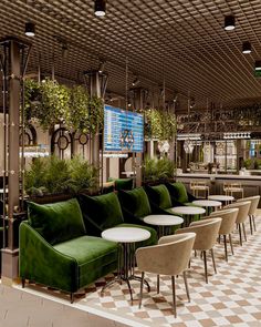 an empty restaurant with green velvet seating and checkered floor