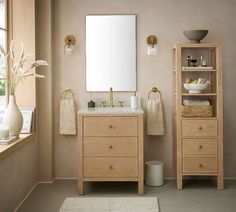 a bathroom with a sink, mirror and shelf next to a window in the room