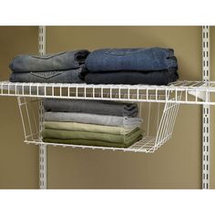 white wire shelving with folded jeans on top