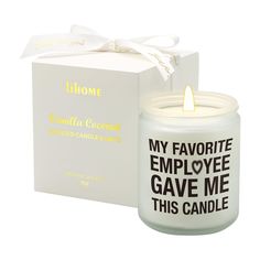 a white candle with the words my favorite employee gave me this candle in front of it