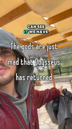 a man wearing a red jacket and hat with the words, the gods are just mad that dysseus has returned