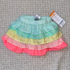 Gymboree Skirt Size 6-12 Months Excellent Condition New With Tags Adorable Bin#7 Playful Skirted Bottoms With Elastic Waistband, Playful Tiered Skirt Bottoms For Spring, Playful Tiered Skirt For Spring, Playful Lined Skirt, Spring Multicolor Playwear Shorts, Spring Ruffled Bottoms For Playtime, Spring Playtime Ruffled Bottoms, Playful Blue Ruffled Bottoms, Playful Multicolor Skirted Bottoms