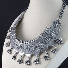 "Antique Silver Hindu Ganesha Bib Necklace. Nice old heavy piece 104.3 grams. Marked 80 in 4 places, I'm assuming that means 80% silver. I tested it and it tests over 80% but below sterling. Total length is about 14.5\" so it would fit most as a choker, it has an old cloth rope holding the bottom links together, one bottom dangle is missing but another could easily be removed to even it out." Heavy Antique Silver Necklaces For Festivals, Heavy Antique Silver Necklace For Festivals, Traditional Heavy Silver Necklace, Handmade Silver Temple Necklace, Traditional Heavy Sterling Silver Necklaces, Handmade Silver Spiritual Temple Necklace, Handmade Spiritual Silver Temple Necklace, Heavy Antique Silver Necklace, Heavy Silver Temple Necklace For Diwali