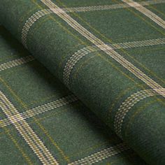 a green plaid fabric with yellow and white checkers on the outside, it is very soft