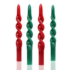 three red and one green toothbrushes in the shape of spirals on a white background