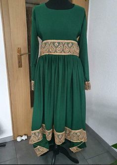 Green Afghan costume with matching trousers and train, Nikkah Bollywood Style Green Dress For Eid, Green Bollywood Dress For Eid, Green Dresses With Long Train, Green Dress With Long Train, Green Full Length Dress With Sweep Train, Traditional Maxi-length Formal Gown, Traditional Maxi Length Gown For Formal Occasions, Formal Long Anarkali Gown, Traditional Maxi Length Formal Gown