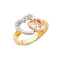 two tone gold and silver heart ring with cubics on the sides, set against a white background