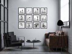 a living room with black and white pictures on the wall next to a brown couch