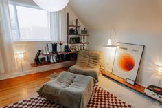 a living room filled with furniture next to a window