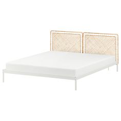 the bed frame is made from metal and has two headboards, one with an open end