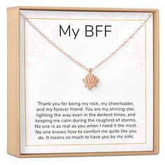 a necklace with the words, my bff on it and a small flower charm