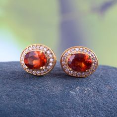 This Sterling Silver Jewelry set features an Elegant Art With Natural Hessonite Gemstone. The cavity is made from genuine solid 925/92.5 Sterling silver with 18k Gold Plating and stamped as S925. This Jewelry is Lead free and Rhodium plated to prevent scratches and tarnish. ITEM DESCRIPTION Item Code: JACBS2/45 Metal: 18k Gold over 925/92.5 Sterling Silver Gemstone: Genuine Natural Hessonite Gemstone Shape: Oval Gemstone Size: 6 X 8 MM Ring Dimension:- Length: 12 MM Width: 11 MM Weight: 3.93 gm Formal Gold Plated Jewelry With Gemstone Accents, Formal Gold-plated Jewelry With Gemstone Accents, Gold Cubic Zirconia Gemstones With Accents, Anniversary Yellow Gold Cubic Zirconia Gemstones, Oval Gemstone Gold-plated Jewelry, Oval Gold-plated Gemstone Jewelry, Oval Gold Plated Gemstone Jewelry, Oval Cubic Zirconia Jewelry With Matching Earrings, Exquisite Ruby Jewelry With Halo Design