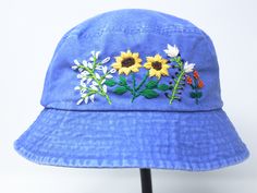 Item: flower embroidered bucket hat Material: 100% cotton Size: one size fits most Color: white, message me if you want to customize the pattern to another color Free first class shipping, upgradable priority mail service. 30 days return policy, feel confident at your purchase! Blue Cotton Sun Hat For Spring, Blue Cotton Sun Hat One Size Fits Most, Blue Bucket Hat With Curved Brim For Spring, Blue Curved Brim Bucket Hat For Spring, Blue Cotton Summer Hat, Blue Cotton Summer Sun Hat, Summer Wide Brim Hat With Embroidered Logo, Summer Hats With Embroidered Logo, Adjustable Cotton Hats For Spring