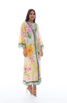 Charm your festival or beach look with this lightweight duster covered in a vibrant floral pattern. Open front Kimono-inspired sleeves 100% polyester Hand wash cold, lay flat to dry Imported Model stats: 5'10", 32" bust, 25" waist, 36" hip. Model is wearing size One Size. Multicolor Print Kimono For Spring Beach Cover-up, Multicolor Floral Print V-neck Kimono, Multicolor V-neck Kimono With Floral Print, Multicolor V-neck Kimono For Spring, Spring Floral Print V-neck Kaftan, Multicolor Bohemian Kaftan For Spring, Bohemian Multicolor Kaftan For Spring, Spring Beach Long Sleeve Kimono, Bohemian Multicolor Print Kimono For Spring