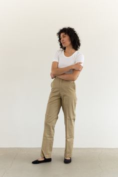 "These military khaki twill wide leg pants are the perfect addition to any wardrobe. They feature the following: zipper fly, straight wide leg, side pockets, back pockets, belt loops. Material: 100% Twill Cotton | Made in the USA in the 60s Condition: Excellent. Deadstock. Unwashed. Measurements: 24\" Waist Button / 34\" Hips / 13\" Rise / 11.5\" Thigh Flat / 31\" Inseam 25\" Waist Metal Tab / 35\" Hips / 13\" Rise / 11.5\" Thigh Flat / 31\" Inseam 26\" Waist Button / 35-36\" Hips / 13\" Rise / Olive Wide Leg Work Pants, Olive Wide Leg Pants For Work, Spring Khaki High-waisted Work Pants, Wide-leg Khaki Chinos For Workwear, Fitted Khaki Chinos For Spring, Wide Leg Khaki Chinos For Work, Khaki Relaxed Fit Wide Leg Chinos, Khaki Wide-leg Relaxed Fit Chinos, Khaki Wide Leg Relaxed Fit Chinos