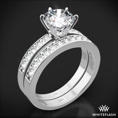 a diamond engagement ring set with channeled diamonds on the band and matching wedding band