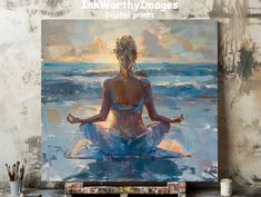 a painting of a woman meditating on the beach in front of an ocean sunset