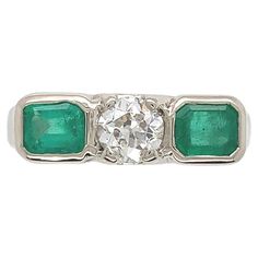 an emerald and diamond three stone ring, by van cleef & co in the early 20th century