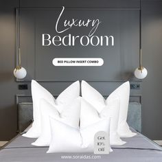 a bed with white pillows in front of a gray wall and the words luxury bedroom above it