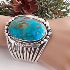 Amazingly Beautiful Piece!! Navajo Artisan Made Huge Kingman Turquoise Stone With Fabulous Matrix Stone Itself Measures 1.5" W X 2" Tall Full Bezel And Mount: 2 " W X 2 3/4" Tall Weight: 130grs. Inside Measurement 5 1/2" W 1 1/8" Gap Fits A Medium Wrist With Adjustment Upwards To A Large Wrist With Great Care. It Is A 9 Band Split Shank In Front Coming Together In Back On Each Side Of Bracelet. Stamped Sterling And Initials Ss This Will Be One Of Your Favorites For Years To Come!