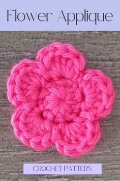 a crochet flower applique is shown in pink