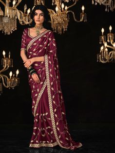 Add the breezy vibrancy of the season to your wardrobe with this captivating purple tissue silk saree. Its rich color, luxurious fabric, and exquisite embellishments make it an ideal choice for any special occasion. Made from high-quality tissue silk material, this saree features intricate sequin work, embroidery work, and tassels on the pallu, adding a luxurious and festive touch to your outfit. The saree comes with a matching color silk material blouse with thread embroidery work, complet Purple Raw Silk Pre-draped Saree With Cutdana, Purple Chanderi Pre-draped Saree For Wedding, Purple Pre-draped Saree With Dori Work, Festive Purple Pre-draped Saree For Wedding, Purple Silk Dupatta For Reception, Unstitched Purple Pre-draped Saree With Dori Work, Purple Art Silk Pre-draped Saree For Navratri, Bollywood Style Purple Raw Silk Pre-draped Saree, Purple Pre-draped Saree With Zari Work For Reception