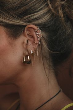 a woman with ear piercings on her ears