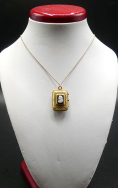 "Vintage gold filled chain and Victorian rectangle photo locket cameo pendant necklace, In good antique vintage condition. The chain 19\" long, Pendant 1\" x 5/8' and ½\" thick. Pendant dates 1890's. Weighs 6.9 gram. Marked 1/20 14k GF on the clasp. Thanks." Vintage Rectangular Locket Pendant, Rectangular Pendant Locket Jewelry For Keepsake, Antique Gold Necklace With Rectangular Pendant, Antique Rectangular Locket Necklace, Vintage Yellow Gold Necklace With Rectangular Pendant, Antique Rectangular Pendant Necklace For Formal Occasions, Antique Rectangular Brass Jewelry, Vintage Square Pendant Locket Jewelry, Antique Engraved Necklace With Rectangular Pendant