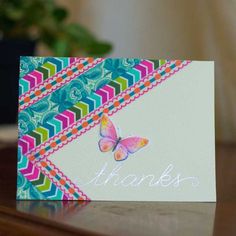 a colorful thank card with a butterfly on it